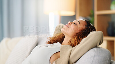 Buy stock photo Woman, sleeping and hands behind head on sofa, living room and lounge for happiness and calm mind. Happy, young female or girl and peace on the home couch, smile and zen mental health for self care