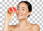 Grapefruit, skincare and woman with food for face, wellness and beauty Portrait of young, happy and Asian model with fruit for nutrition, diet and body health isolated on a png background