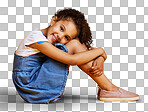 A portrait mixed race girl looking sitting alone isolated Cute hispanic child posing inside. Happy and cute kid smiling and looking carefree in casual clothes isolated on a png background