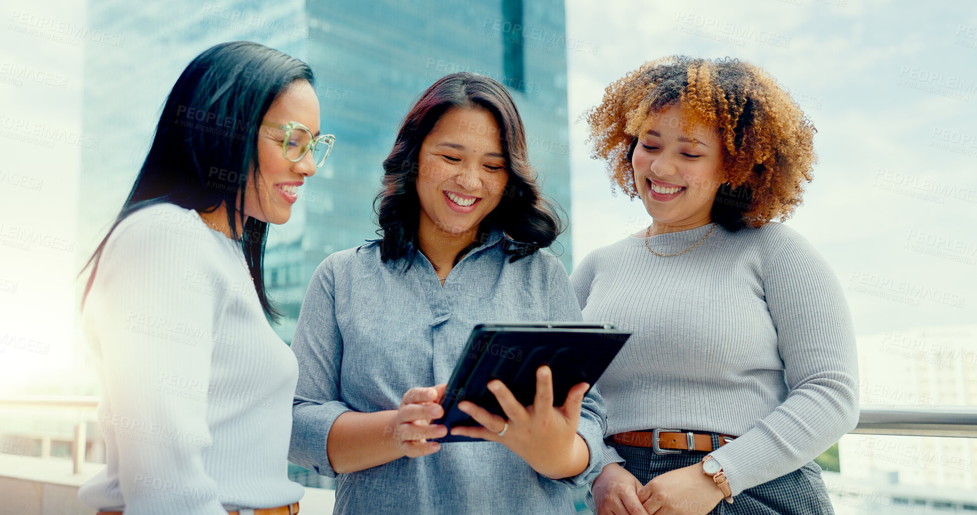 Buy stock photo Tablet, collaboration and business women on rooftop of building in city for planning project. Digital technology, teamwork and professional female designers working in collaboration on office balcony