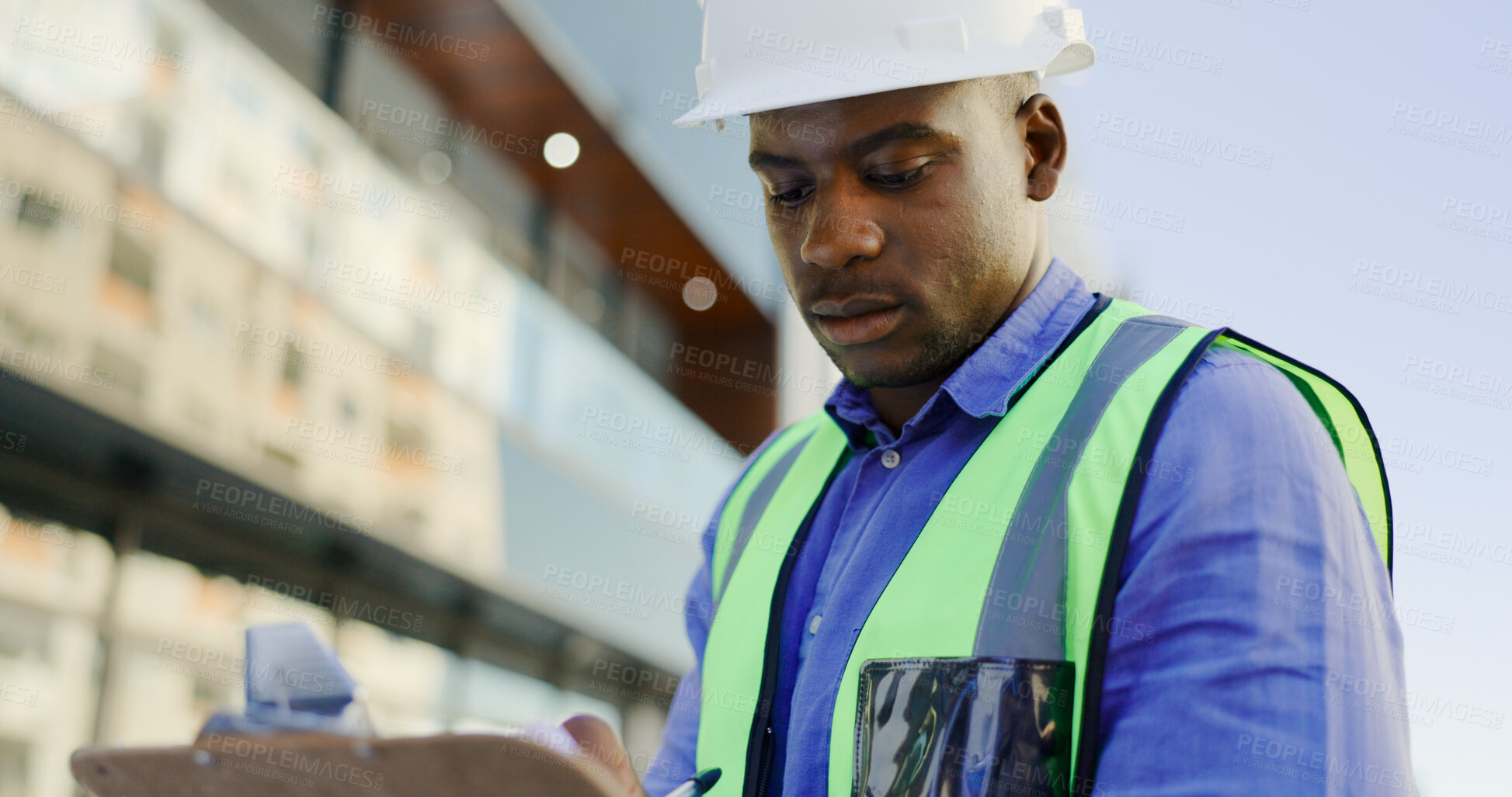 Buy stock photo Black man, architect and writing in city for construction planning, engineering or safety compliance. African male person, contractor or builder taking notes on site for architecture or inspection