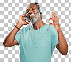 One happy mature African American man wearing headphones and listening to music while dancing in the studio. Smiling black man feeling free while expressing through dance isolated on a png background