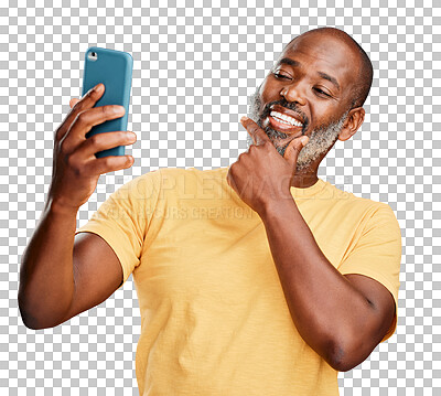 Buy stock photo One contemplative trendy mature african american man taking a selfie on a smart phone against a isolated on a png background. Fashionable black man standing and posing while taking pictures for social media