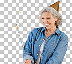 One happy mature caucasian woman playing with a sparkler on her birthday while posing against isolated on a png background. Smiling white lady showing joy and happiness while celebrating
