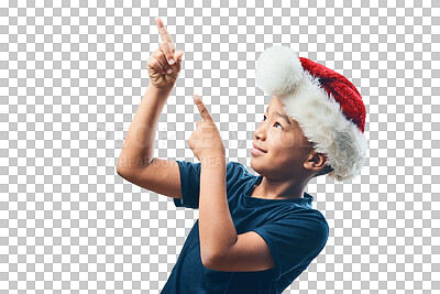 Buy stock photo Studio shot of a cute little boy wearing a Santa Claus hat and pointing against a grey background
