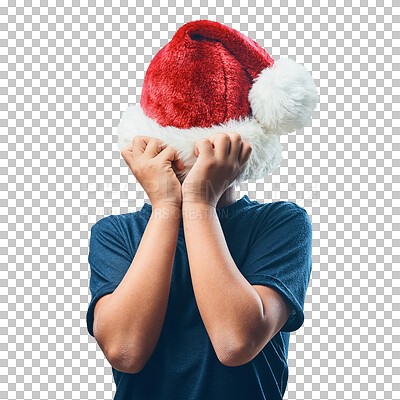 Buy stock photo Studio shot of a cute little boy covering his head with a Santa hat against a grey background