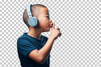 Buy stock photo Studio shot of a cute little boy using headphones and putting his finger on his lips against a grey background