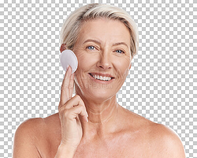 Buy stock photo Portrait of a  mature caucasian woman using a cotton pad to remove makeup during a selfcare grooming routine. Older model  applying cleanser to her face against pink copyspace background