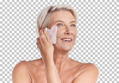 One mature woman woman using a gua sha stone for deep cell penetration against wrinkles. Happy older woman using anti ageing tool against purple copyspace background