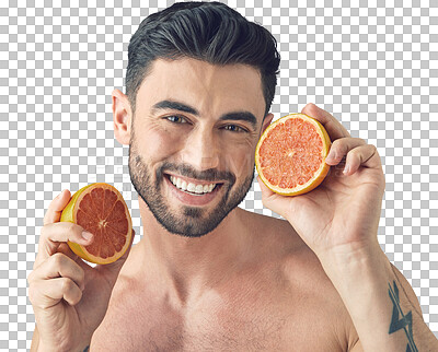 Buy stock photo Studio shot of a handsome young man holding up a grapefruit