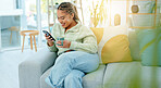 Black woman on sofa with smile, phone and coffee surfing internet, social media or web in living room. Relax, reading email or typing text, happy gen z girl on couch with smartphone on break with cup