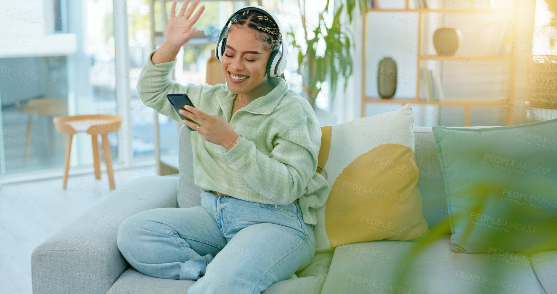 Buy stock photo Woman, wave and headset on video call in living room with people, friends or family from holiday to Bali. African, person and happy on face, smile or excited with telecom on internet, app or web
