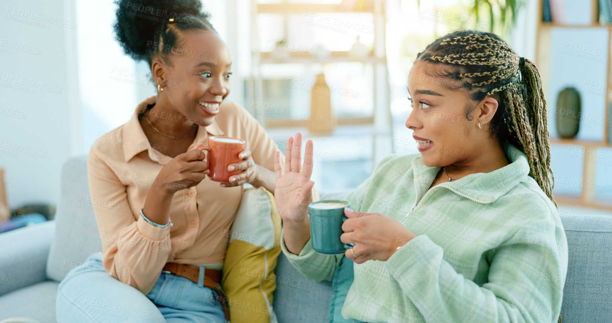 Buy stock photo Woman, best friends and talk with coffee in living room with smile, happiness or excitement. African, people and bonding with gossip, conversation or discussion for advice on sofa, joke or tea in cup