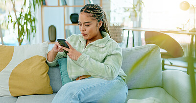 Buy stock photo Home, typing and woman with a smartphone, relax and connection with social media, contact and network. Person, apartment and girl with a cellphone, mobile user and internet with digital app and post