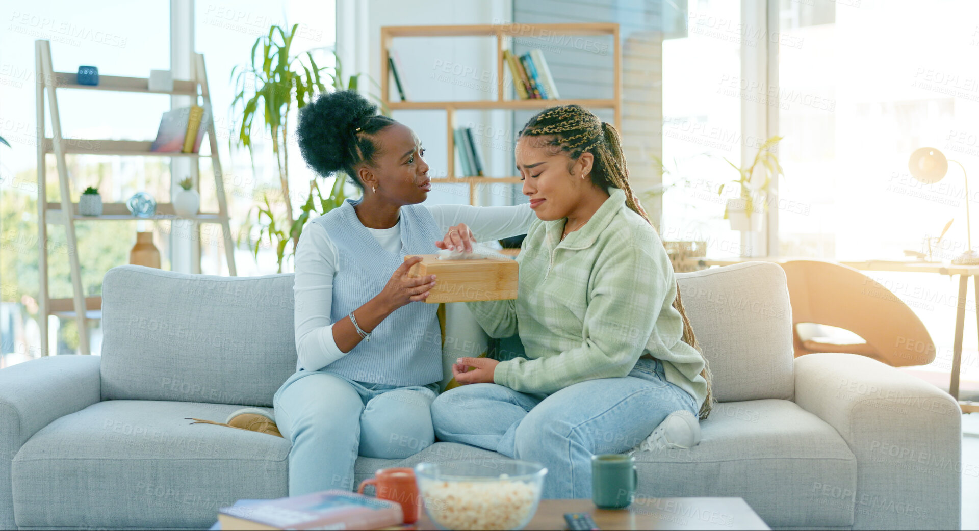 Buy stock photo Woman, friends and sad on sofa in living room with support, empathy or comfort for divorce. African, people and together for talk, crying and compassion for loss, grief or stress with understanding