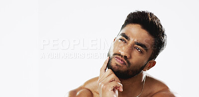 Confused, thinking and face of man in studio for wellness, skincare and hygiene on white background. Doubt, portrait and indian male model with unsure emoji contemplating beauty cosmetic or body care