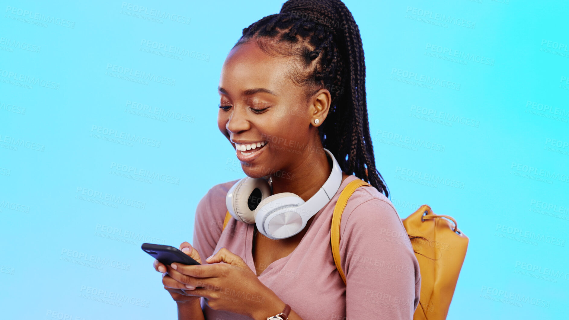 Buy stock photo Black woman, student and phone for social media, happy college communication or internet search in studio. Young person with mobile chat for university contact and scholarship FAQ on blue background