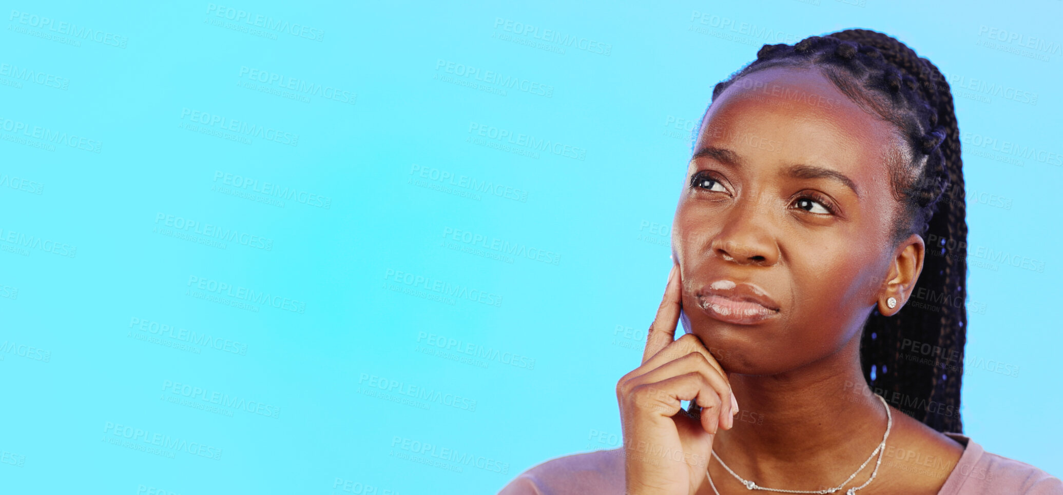 Buy stock photo Thinking, idea and black woman in doubt with mockup and confusion isolated on blue background. Ideas, concentration and difficult choice for person in studio space with thoughtful expression on face