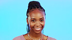 Face, laughter and smile of an African girl in studio isolated on a blue background for fun or humor. Portrait, happy and laughing with an attractive young female enjoying a joke, comic or funny comedy