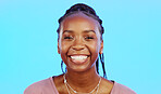 Face, laughter and smile of a black woman in studio isolated on a blue background for fun or humor. Portrait, happy and laughing with an attractive young female enjoying a joke, comic or funny comedy