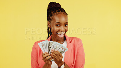 Finance, fan and winner with a black woman in studio on a yellow background holding  cash, money or wealth. Financial, investment and trading with dollar bills  in the hand of a female