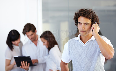 Buy stock photo Phone call, office and business man with team in serious conversation, discussion and networking. Communication, corporate and male worker on cellphone talking, speaking and connection in workplace