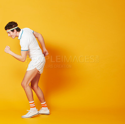 Buy stock photo Fist, exercise and sports man isolated on yellow background in power workout, training and retro athlete mockup. Moving, walking and celebration of tennis player or person, fitness energy and studio