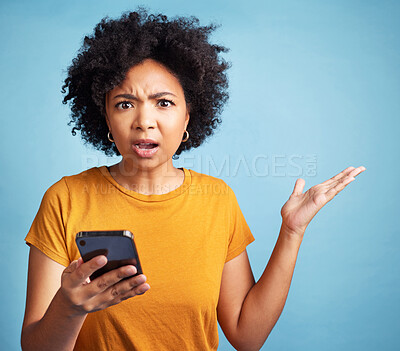 Buy stock photo Confused, phone and woman portrait isolated on blue background for college doubt, decision or questions. Stress, surprise and young person or student in what or why hand for mobile problem or choice