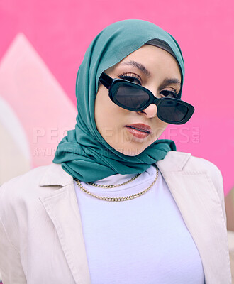 Buy stock photo Young muslim woman, fashion and portrait by wall with trendy gen z aesthetic, beauty and art deco in city. Edgy islamic girl, student and clothes with sunglasses, freedom and travel in Dubai metro