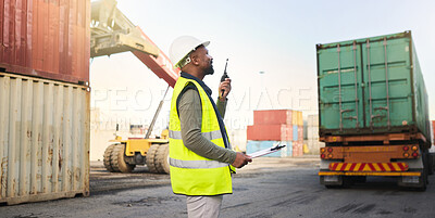 Buy stock photo Black man working on stock, logistics and cargo delivery in the transport and supply chain industry at the shipping port. Employee with radio communication to export container for export distribution