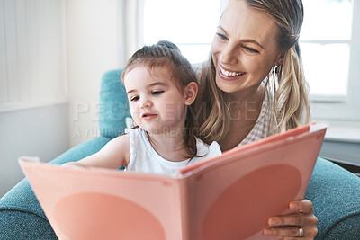 Buy stock photo Book, family and love with a mother and daughter reading a story on a couch in the living room of their home together. Children, love and education with a woman and daughter bonding over a storybook
