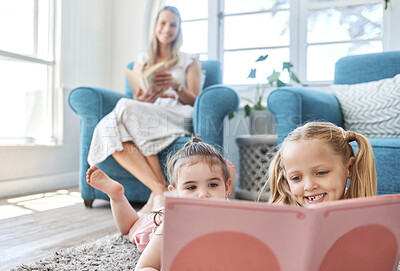 Buy stock photo Development, mother and girl children reading with book, smile and happy on floor, together and home. Female, lady and daughters doing childcare, growth and fun, laugh or education for learning