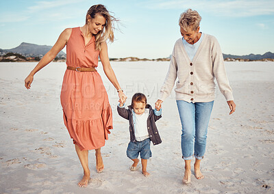 Buy stock photo Beach, mother and grandma with boy holding hands having fun, bonding and walking. Family, care and grandmother, mom and kid or child enjoying holiday time together outdoors on sandy seashore or coast