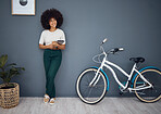 Tablet, bicycle and portrait of black woman in home web or internet browsing. Smile, relax and happy female from South Africa on digital touchscreen tech, mobile app or networking on social media.
