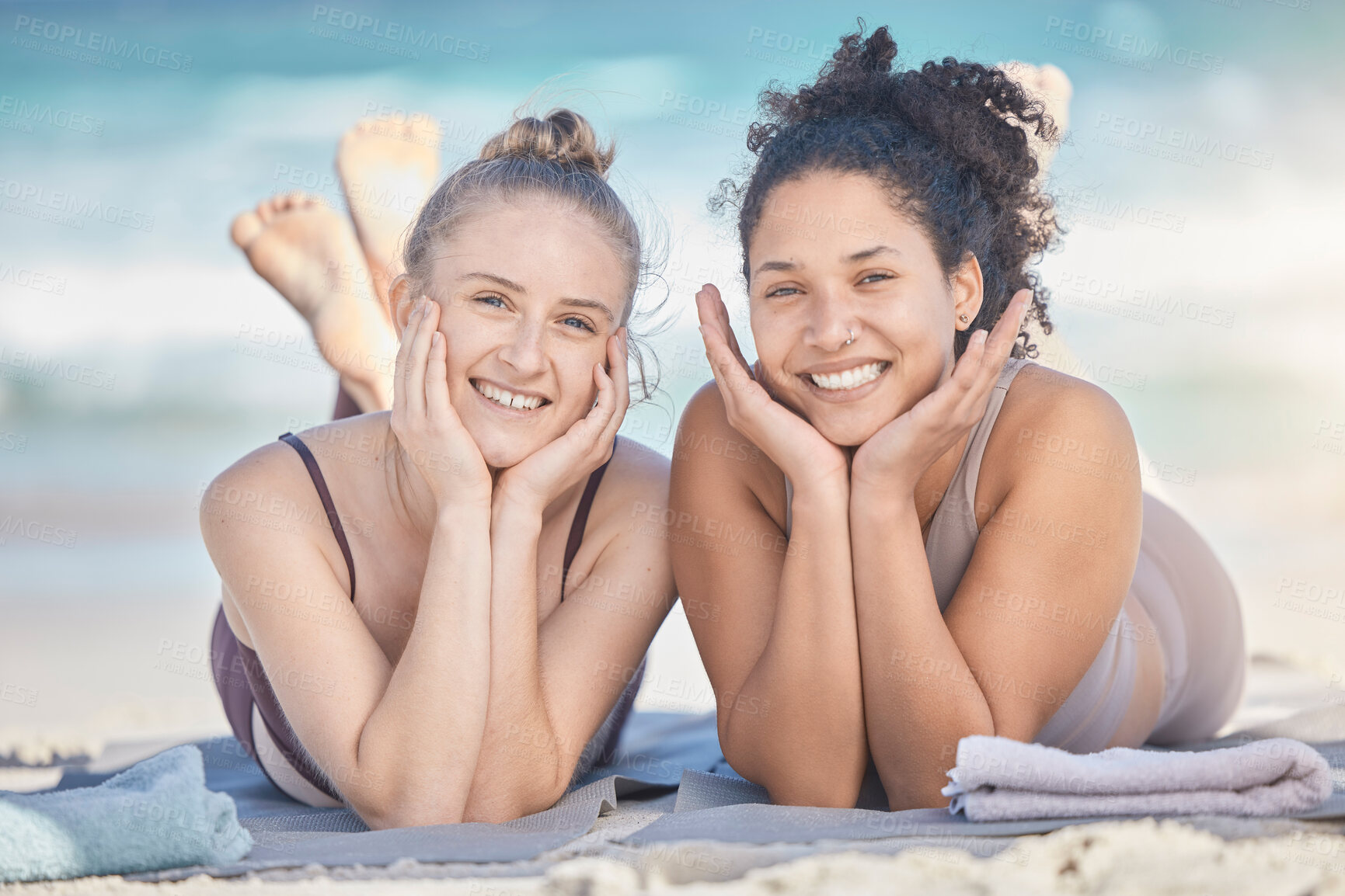 Buy stock photo Friends, smile and beach happiness with women together on vacation, holiday and travel while lying on sand, bonding and enjoying freedom. Face portrait of lesbian couple outdoor at sea for summer fun
