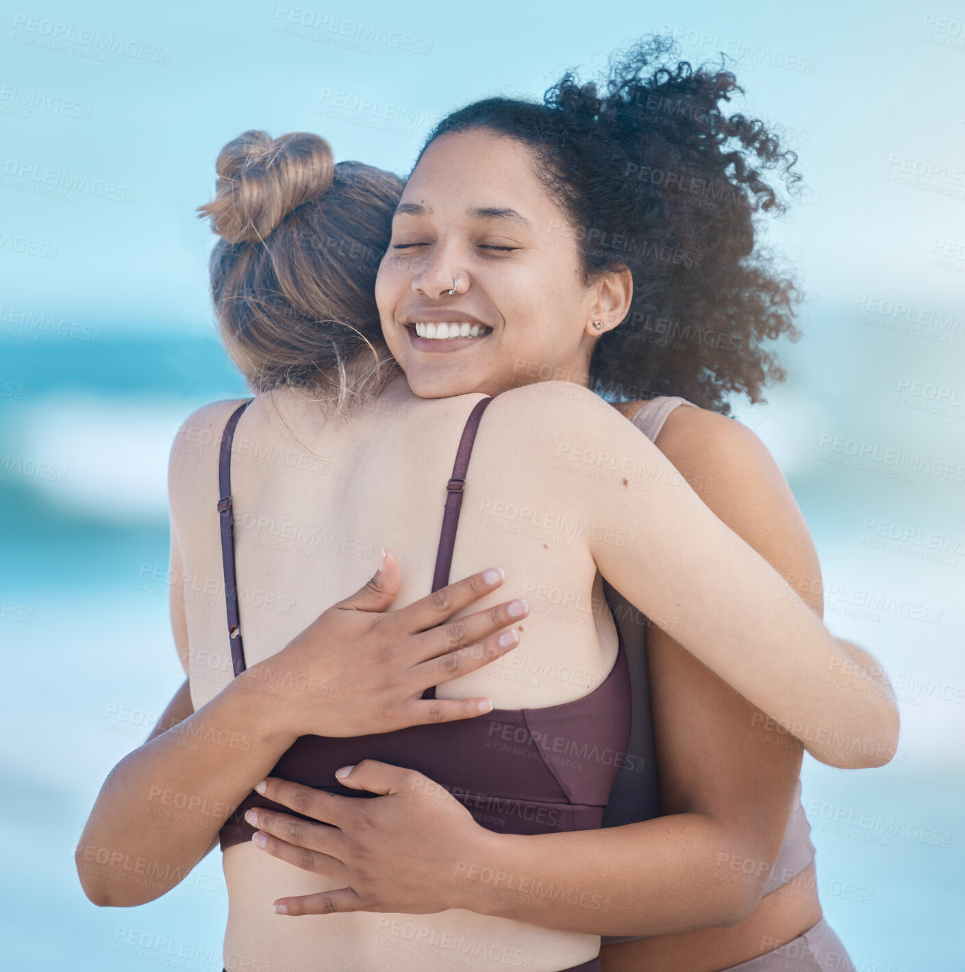 Buy stock photo Friends, women and hug after exercise outdoor, happy and calm at the beach with love and fitness together. Support, trust and friendship, workout motivation by the ocean and wellness with zen smile.