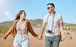 Couple, holding hands and travel walking in nature with happiness, love and freedom in nature, Adventure, vacation and safari walk of friends or happy couple smile on holiday in Africa together