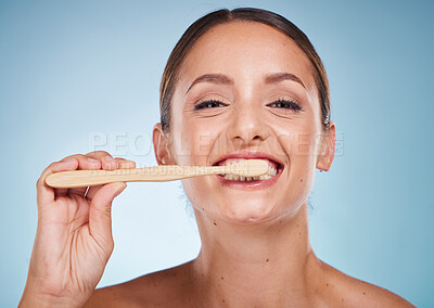 Buy stock photo Brushing teeth, dental and woman with toothbrush for teeth whitening and beauty, oral health and fresh breath with studio background. Mouth wellness, Invisalign portrait and clean with bamboo brush.