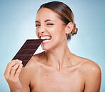 Chocolate, diet and beauty with woman and skincare with healthy candy, luxury and wellness with food and portrait. Happy with calories, cosmetic and cacao dessert with skin against studio background 