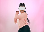 Black woman, VR and gamer in the metaverse for futuristic gaming or activity against a pink studio background. African American female in 3D virtual reality game with headset in the future on mockup