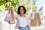 Black woman, portrait and happy with shopping bag in city for discount, sale and sunshine with promotion. Young gen z girl, metro and excited with retail, fashion and gift on walk outdoor in street