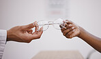 Hands, vision or glasses with an optometrist and customer in an eyewear store closeup for prescription lenses. Healthcare, medical and optometry with a optician giving frame spectacles to a client