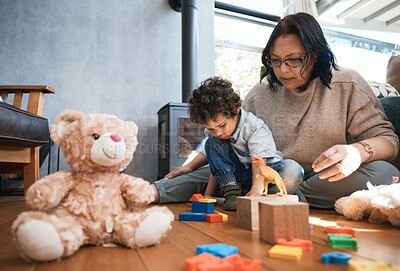 Buy stock photo Toys, family or kids with a mother and son playing in the bedroom of their home together for child development. Children, teddy bear or education and a boy learning motor skills with a woman parent
