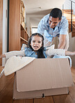 Dad, child and box, playing on floor in home with love and fantasy for happy family with smile and fun. Cardboard ride, playful bonding and father with girl in new house, games and adventure for kids