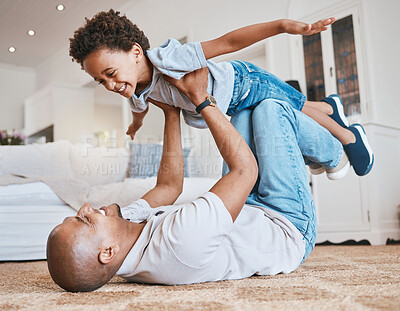Buy stock photo Child, dad and airplane game on floor with smile, bonding and love in living room, family home and care. Father, boy kid and together for playing, plane and excited on carpet in lounge with lifting