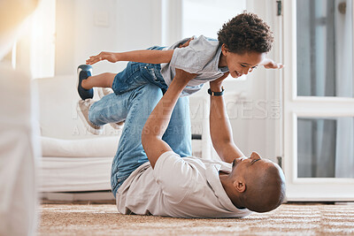 Buy stock photo Kid, father and plane game on floor with smile, bonding and love in living room, family home and care. Man, body child and together for playing, airplane and excited on carpet in lounge with lifting