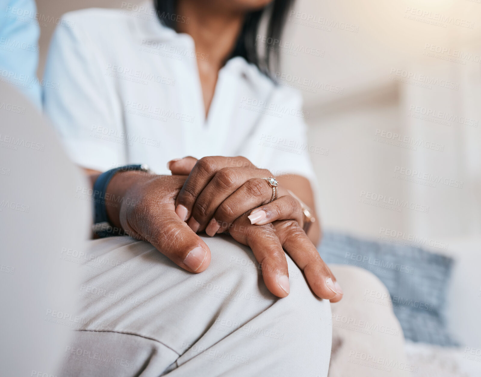 Buy stock photo Couple, closeup and holding hands on sofa, home living room and marriage with care, love and support. Man, woman and kindness on lounge couch with empathy, connection and strong partnership in house