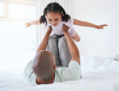 Buy stock photo Airplane, playful and father with daughter in bedroom for morning, wake up and weekend. Happy, excited and funny with man and young girl playing in family home for happiness, freedom and support