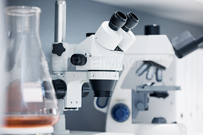 Buy stock photo Science, laboratory and microscope with pharmaceutical test for healthcare study and medicine. Medical tools, research and innovation in health care, biotechnology and zoom on chemical investigation.