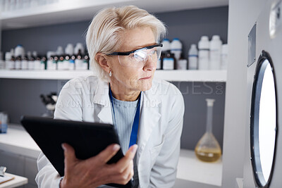 Buy stock photo Scientist, tablet and senior woman with incubator for test, analysis or research study in laboratory. Technology, medical professional and serious science doctor check machine for biology experiment